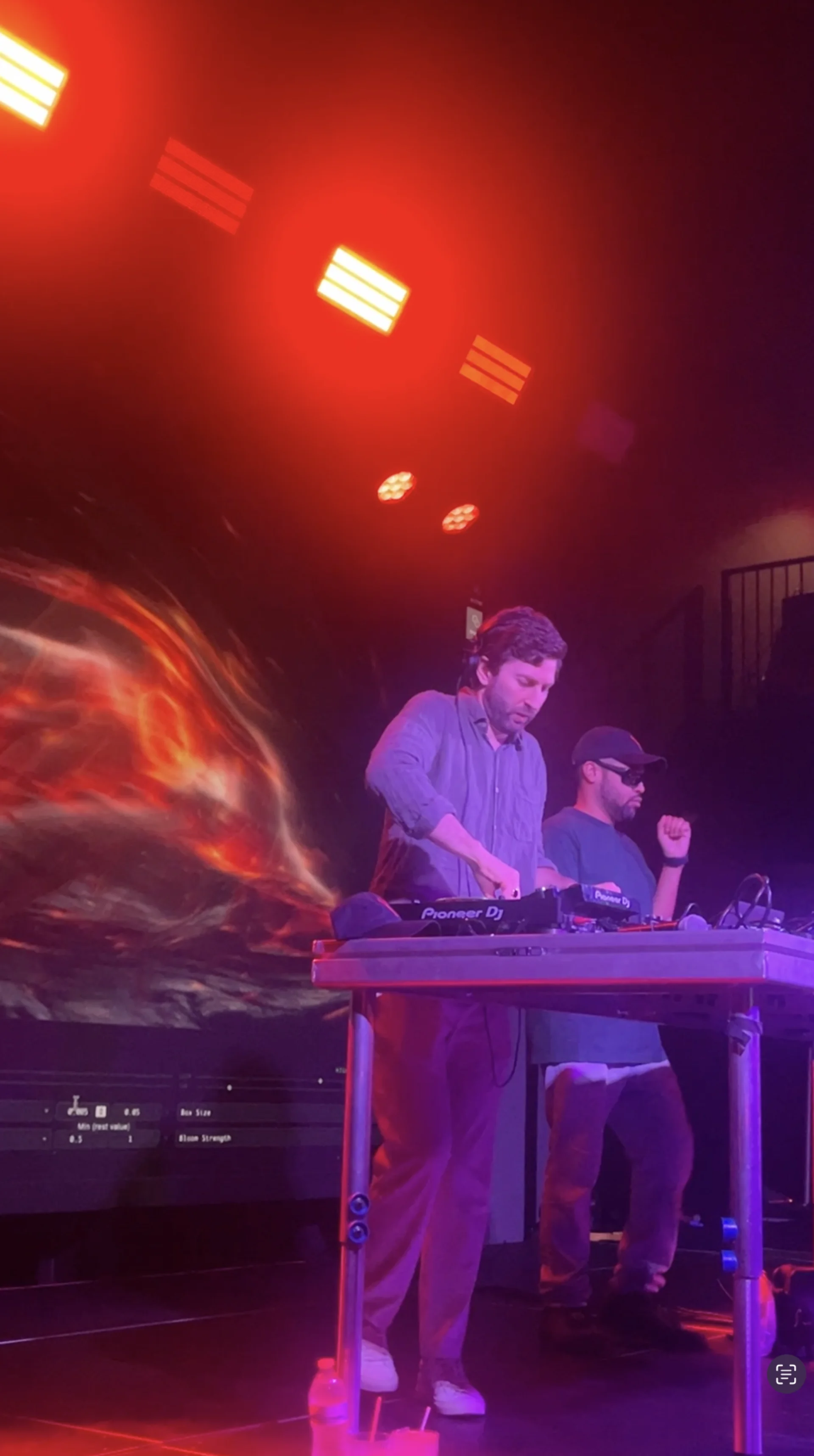 Performing with fire-like generative shader on LED wall