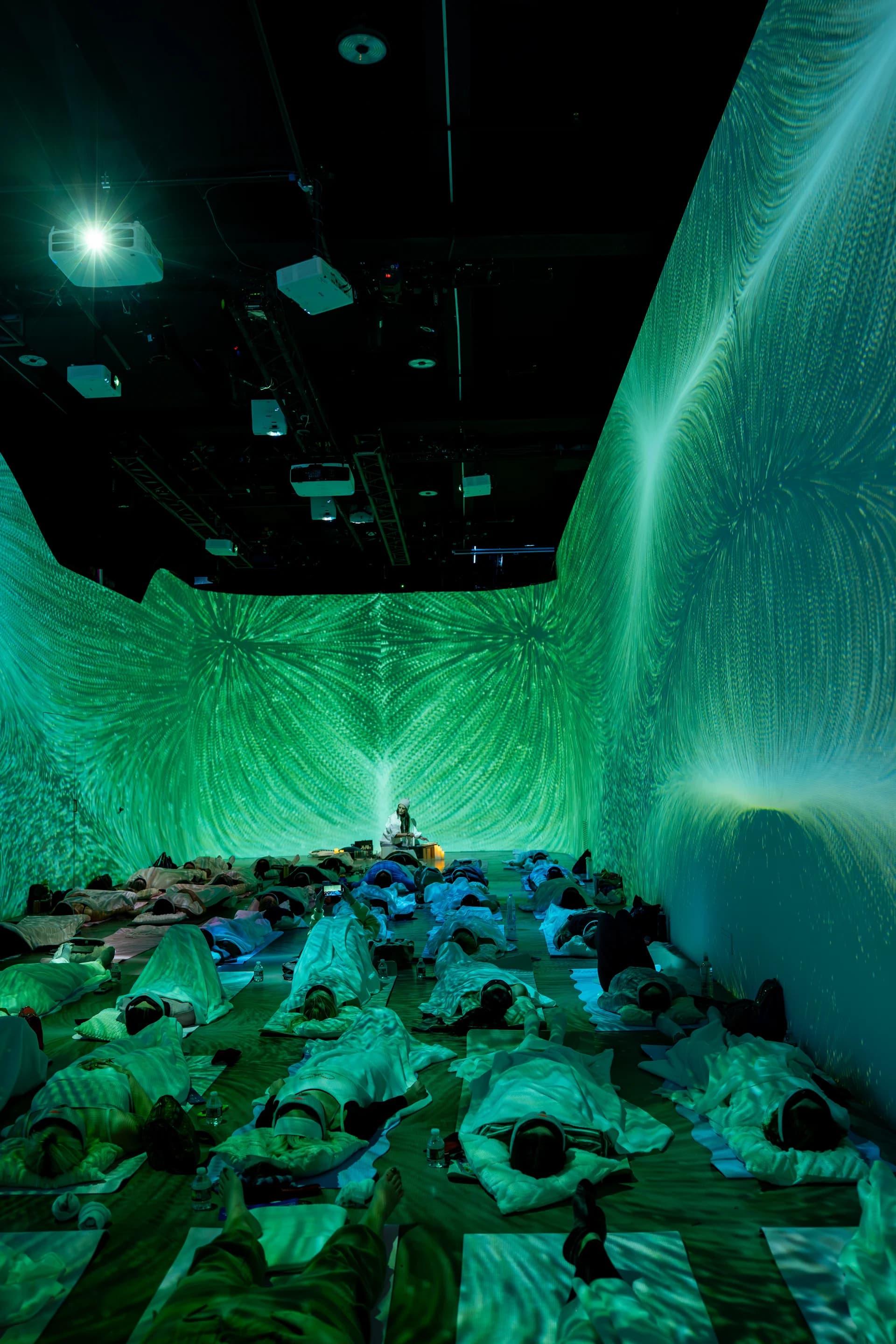 360° green generative projections filling the room during sound healing